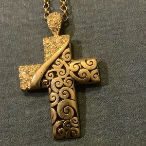 Beautiful cross charm with long necklace.